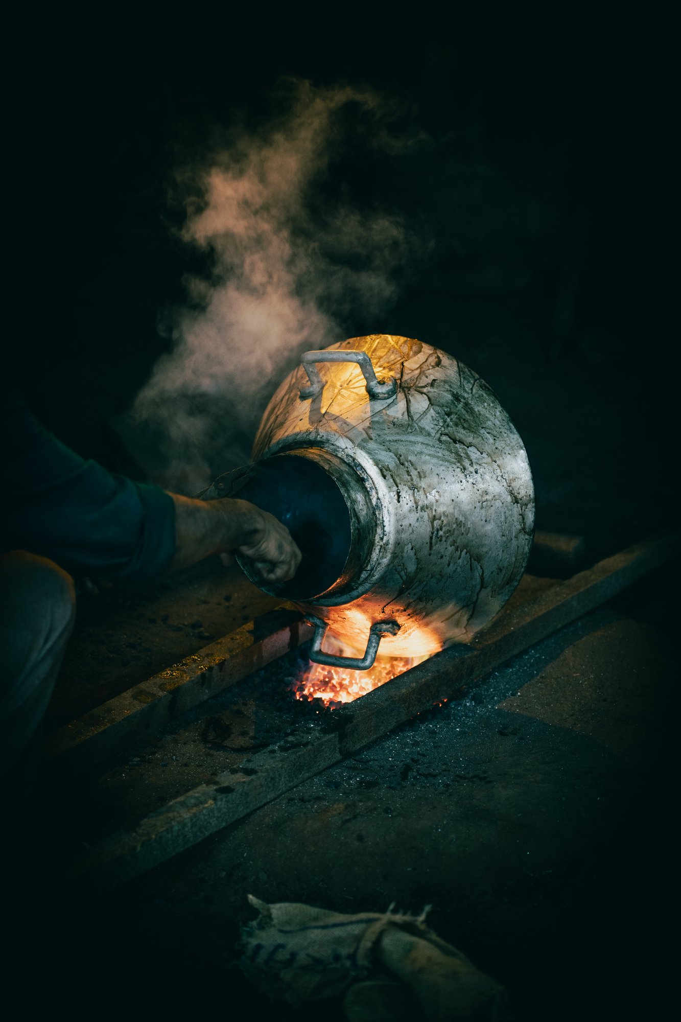 An artisan hand-finishing metalware